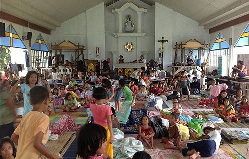 People_take_shelter_in_a_parish_church_in_the_Philippines_after_Typhoon_Haiyan_swept_through_the_area_Credit_Caritas_Manila_CNA_11_11_13